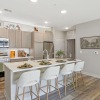 Styled apartment kitchen with island and bar stools