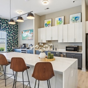 Clubhouse kitchen with leather bar stools